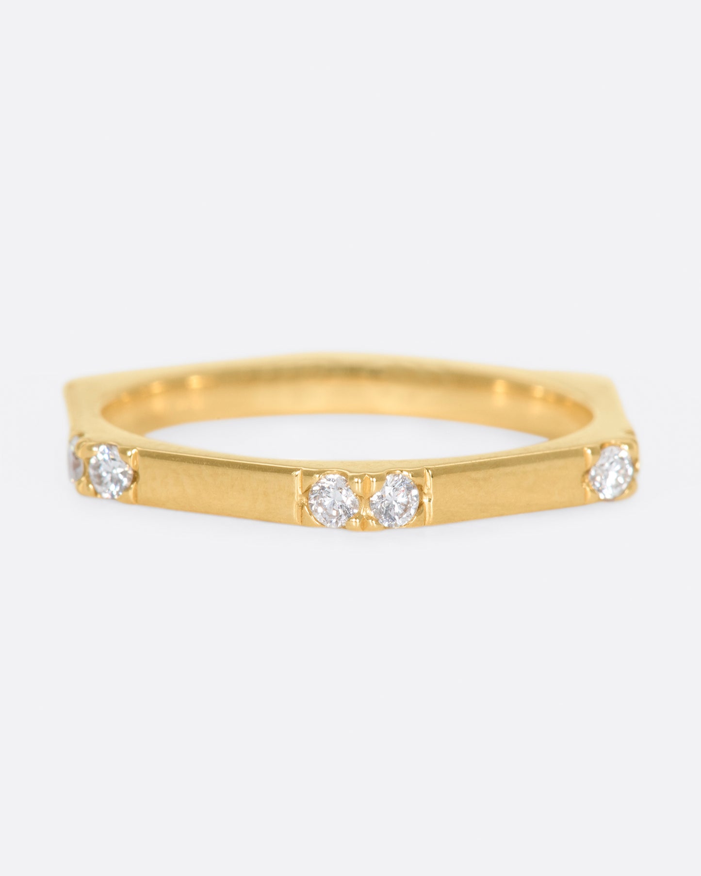 A hefty, hexagonal ring with diamond on each corner.