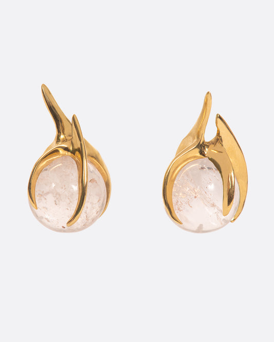 A pair of hand carved prong earrings holding morganite spheres, shown from the front.
