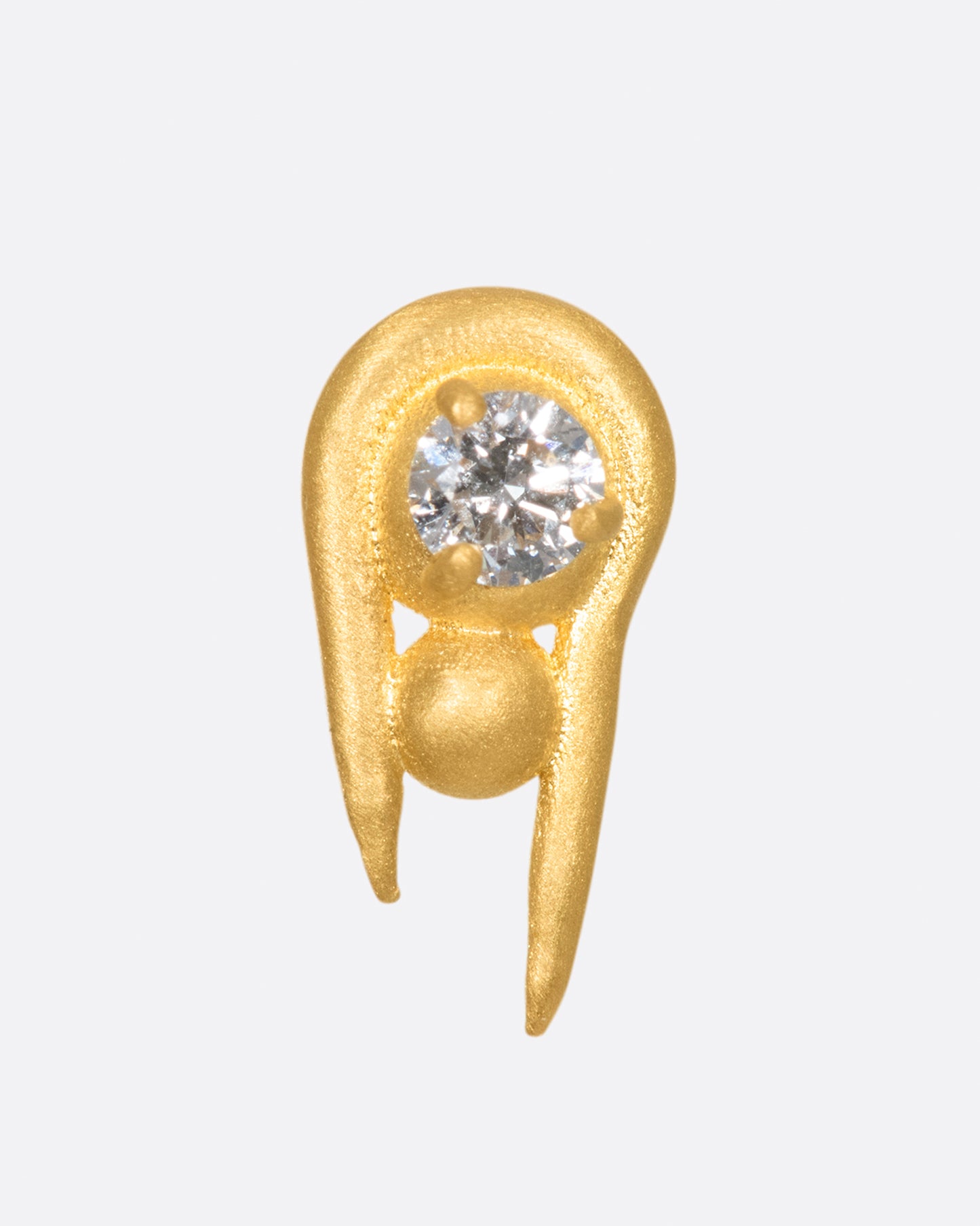 A curved high karat gold earring with a stacked sphere and brilliant cut diamond. Shown from the front.