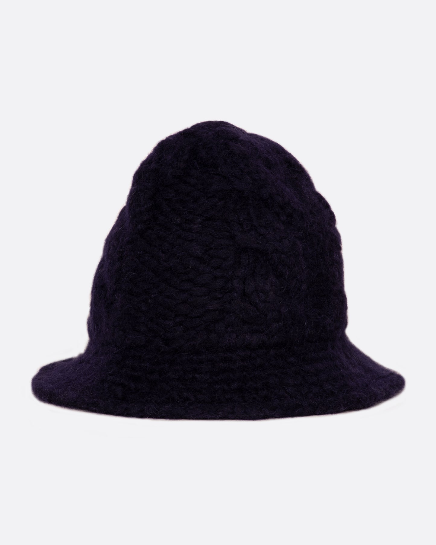 A chunky navy cable knit bucket hat with a narrow brim. Shown from the front.