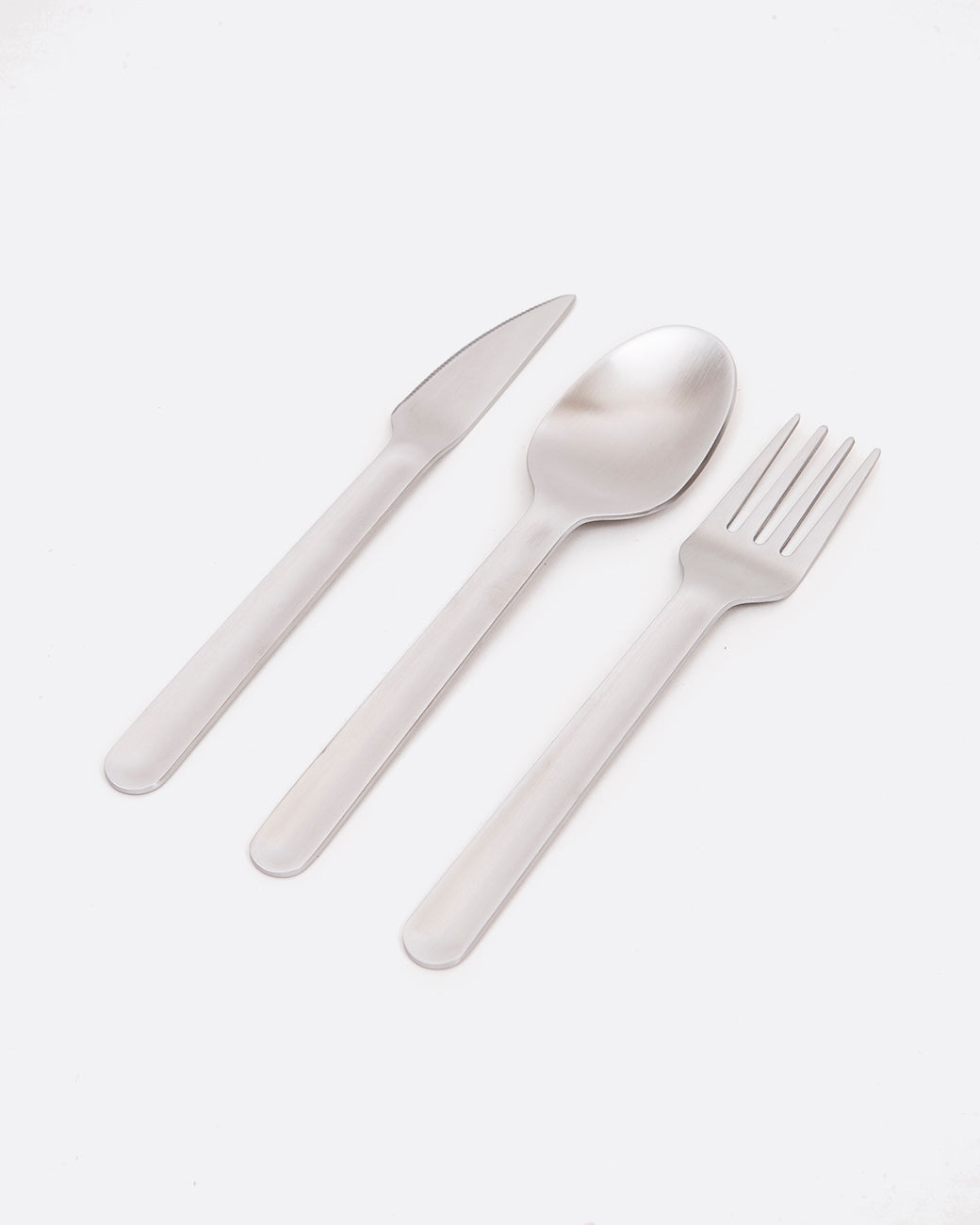 three utensils, fork, knife and spoon side by side