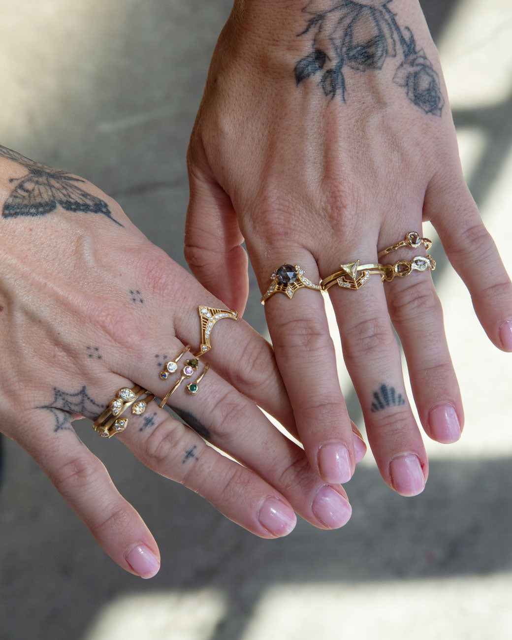 womans hand with rings stacked on the fingers including the one for sale here