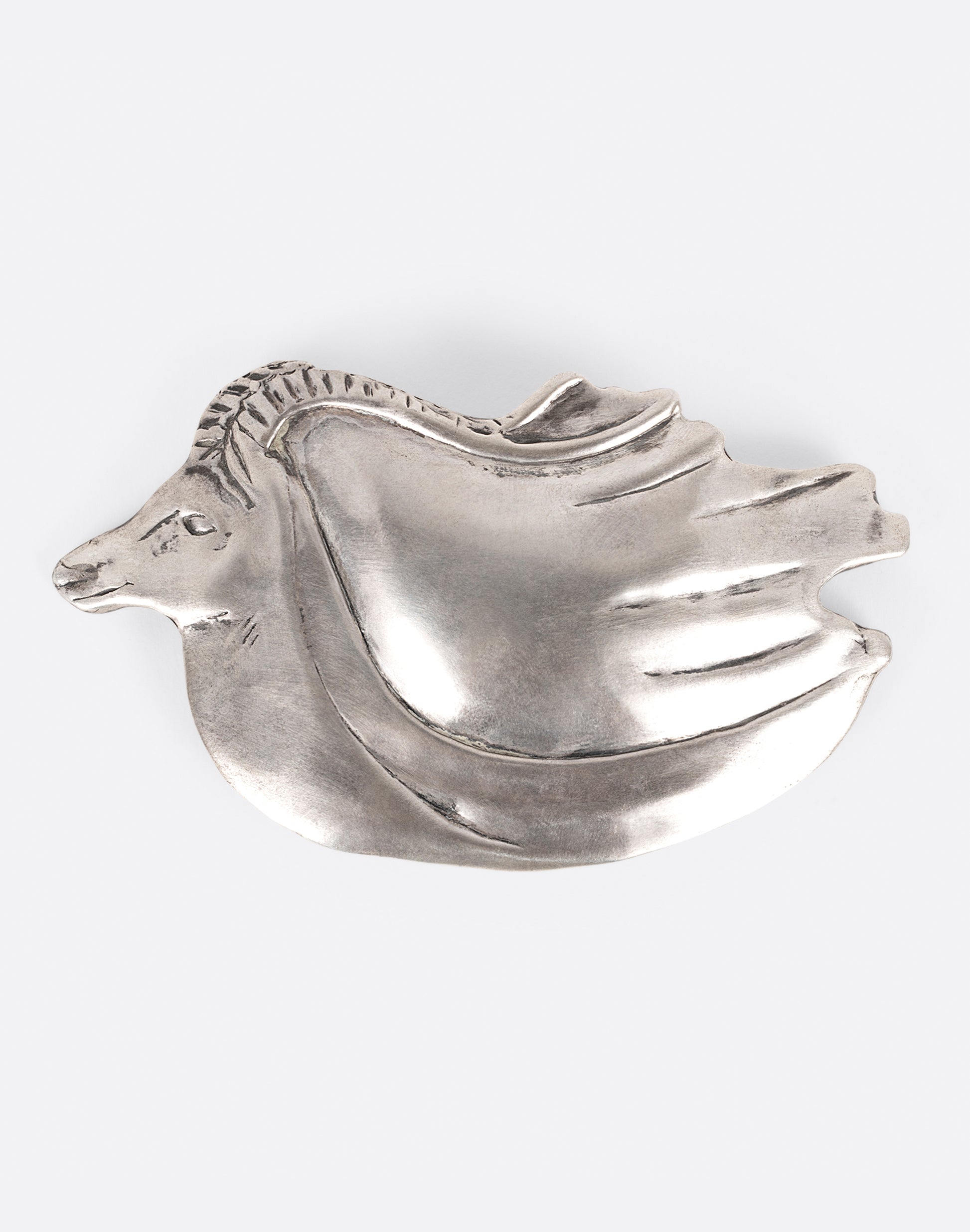 A silver ram belt buckle shown from the front.