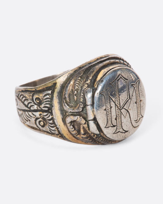 This vintage poison signet ring is beautifully engraved with the initials RM (or MR) and two wise owls along the band