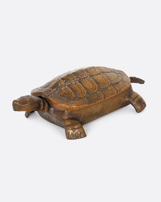 Vintage brass turtle box, shown from the side.