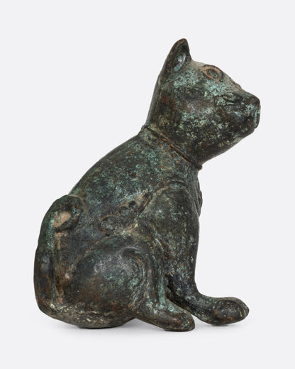 An antique cast iron dog, shown from the side.