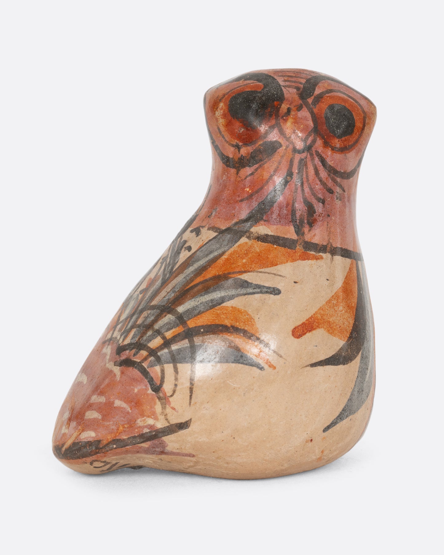 A hand painted tonala style owl figurine. Shown from the front.