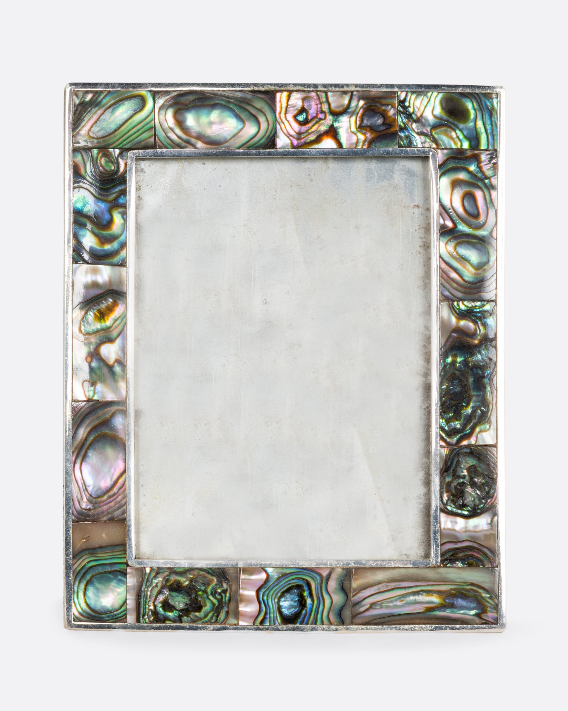 A silver rectangular picture frame with abalone inlay. Shown from the front.