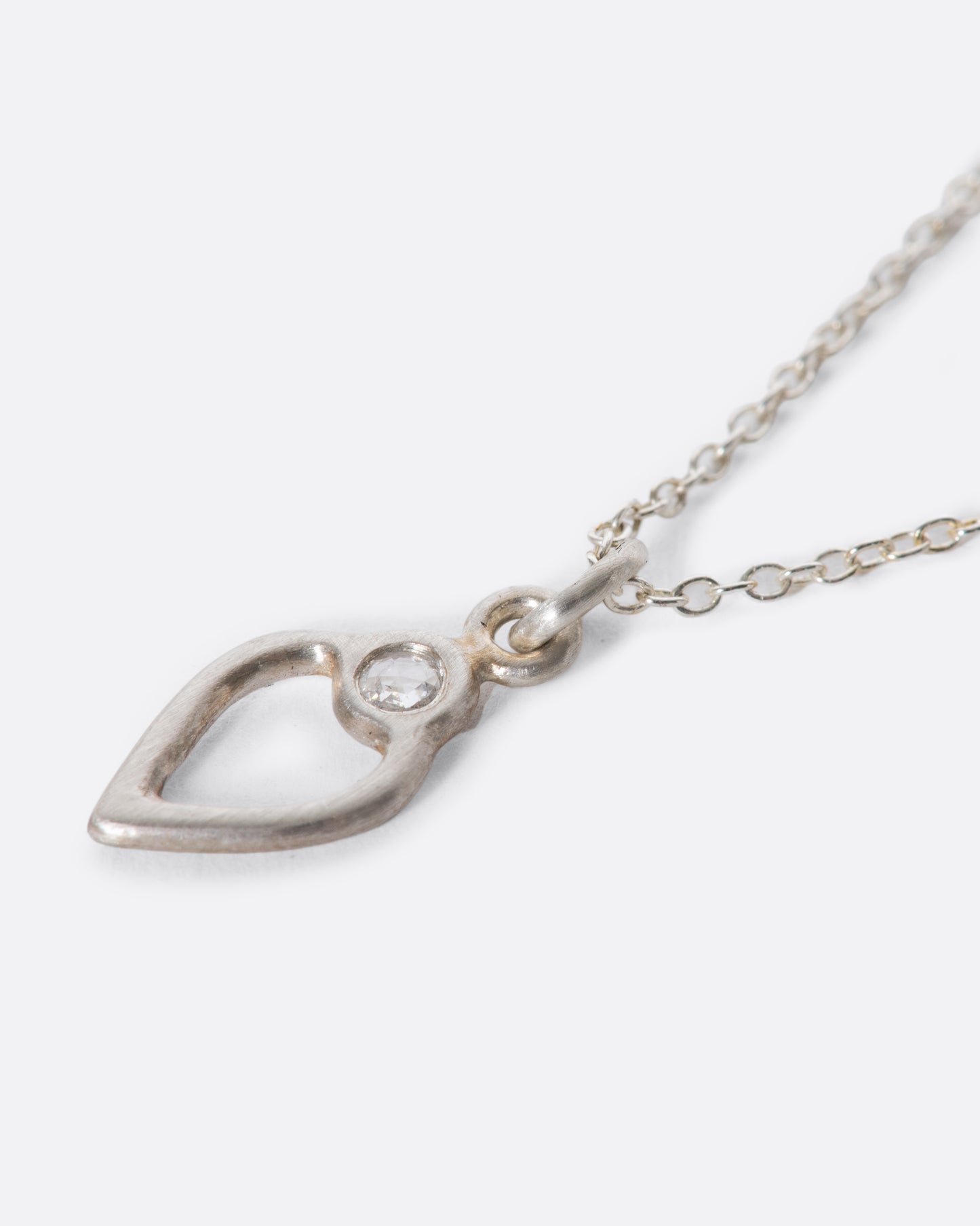A delicate heart pendant necklace with a rose-cut diamond detail. The perfect piece if you're looking for something simple and unique to wear daily.