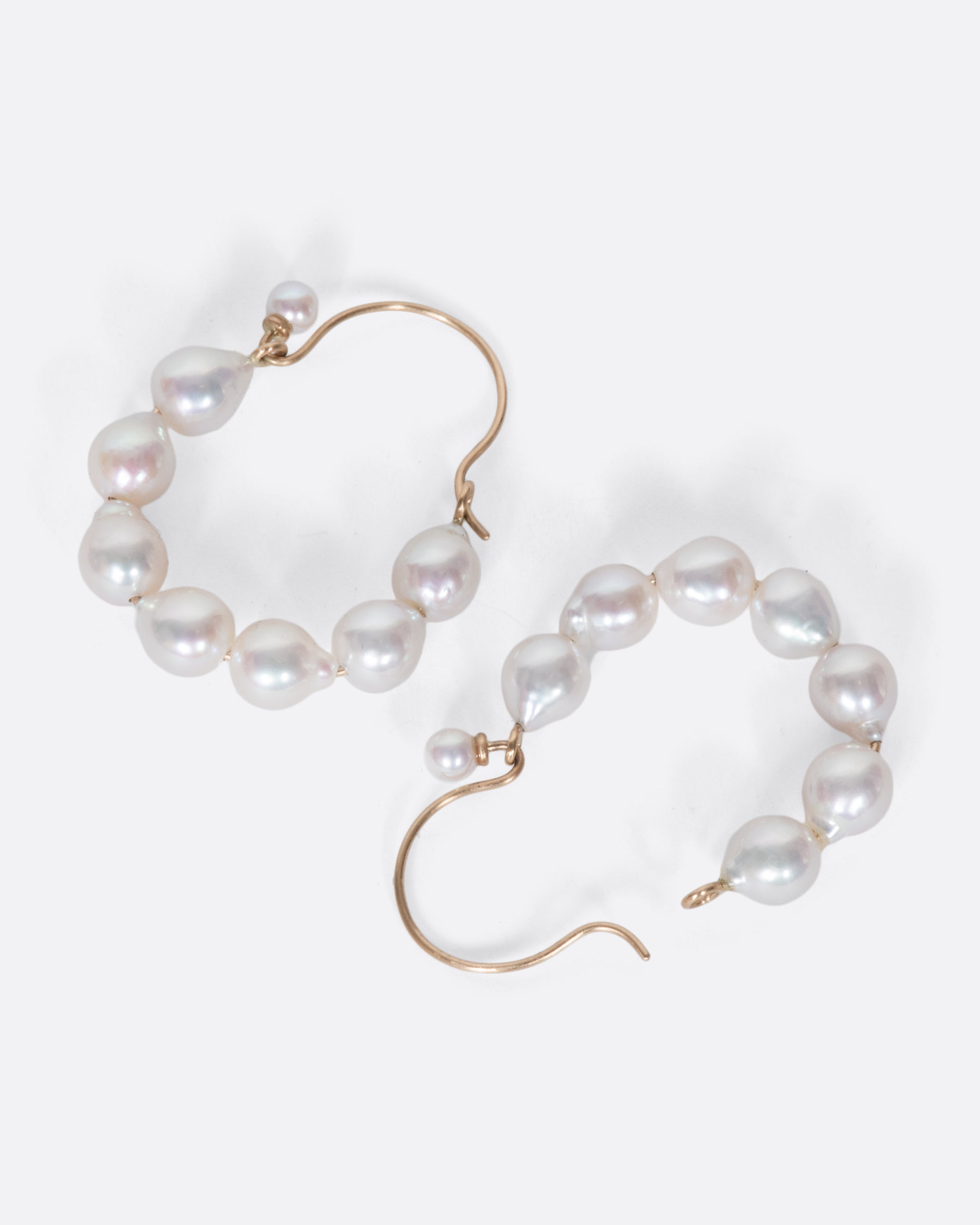 A lovely pair of baroque pearl hoops with a tiny pearl hiding the closure