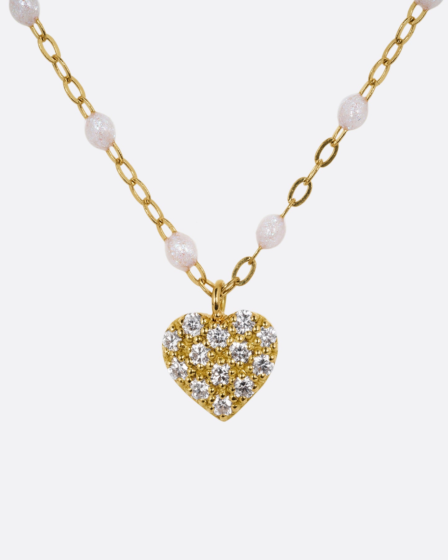 yellow gold necklace with resin and diamond heart charm shown from the front 