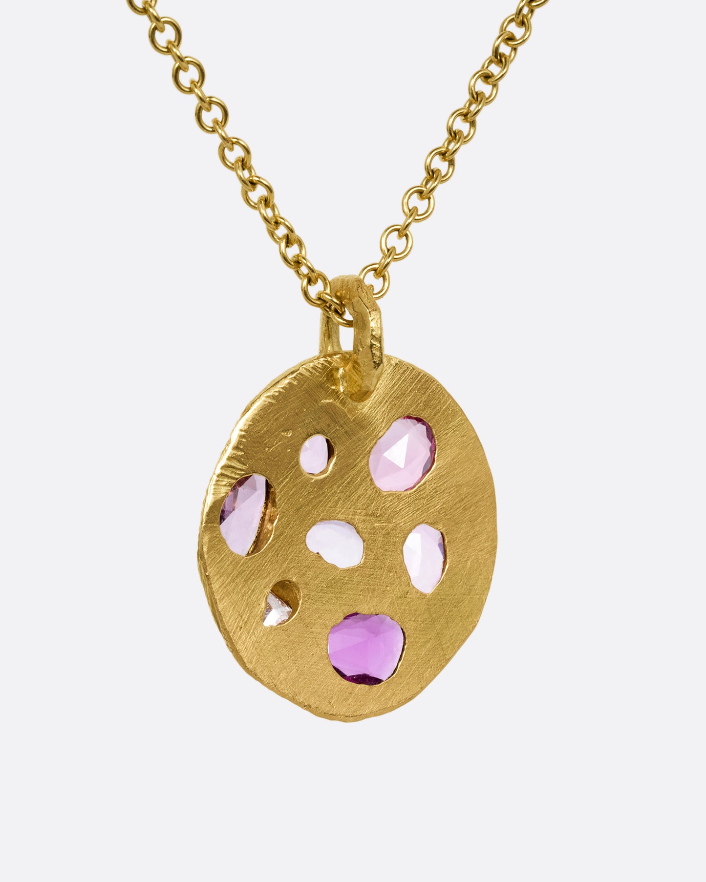 yellow gold necklace with pink sapphire pendant shown from the back