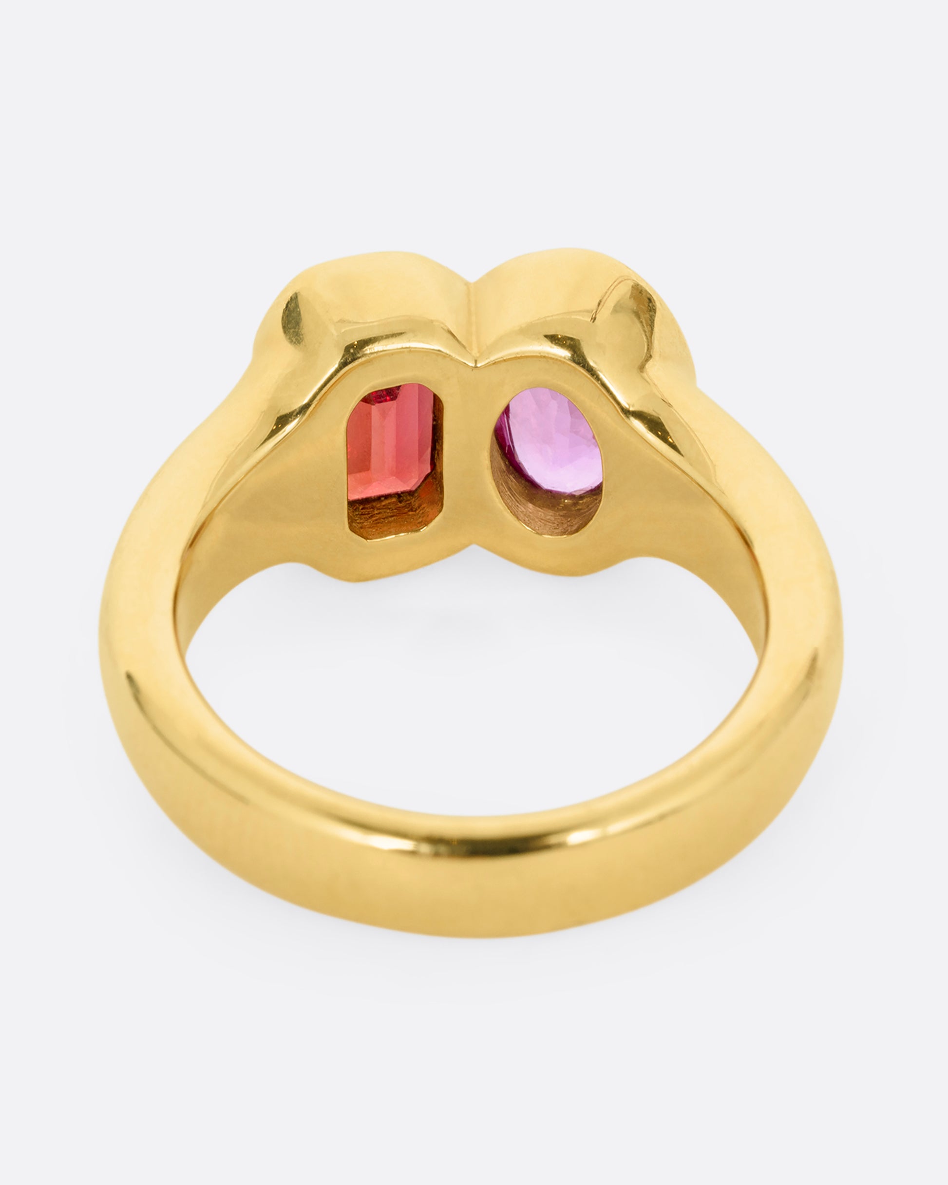 yellow gold ring with red and orange sapphires shown from the back