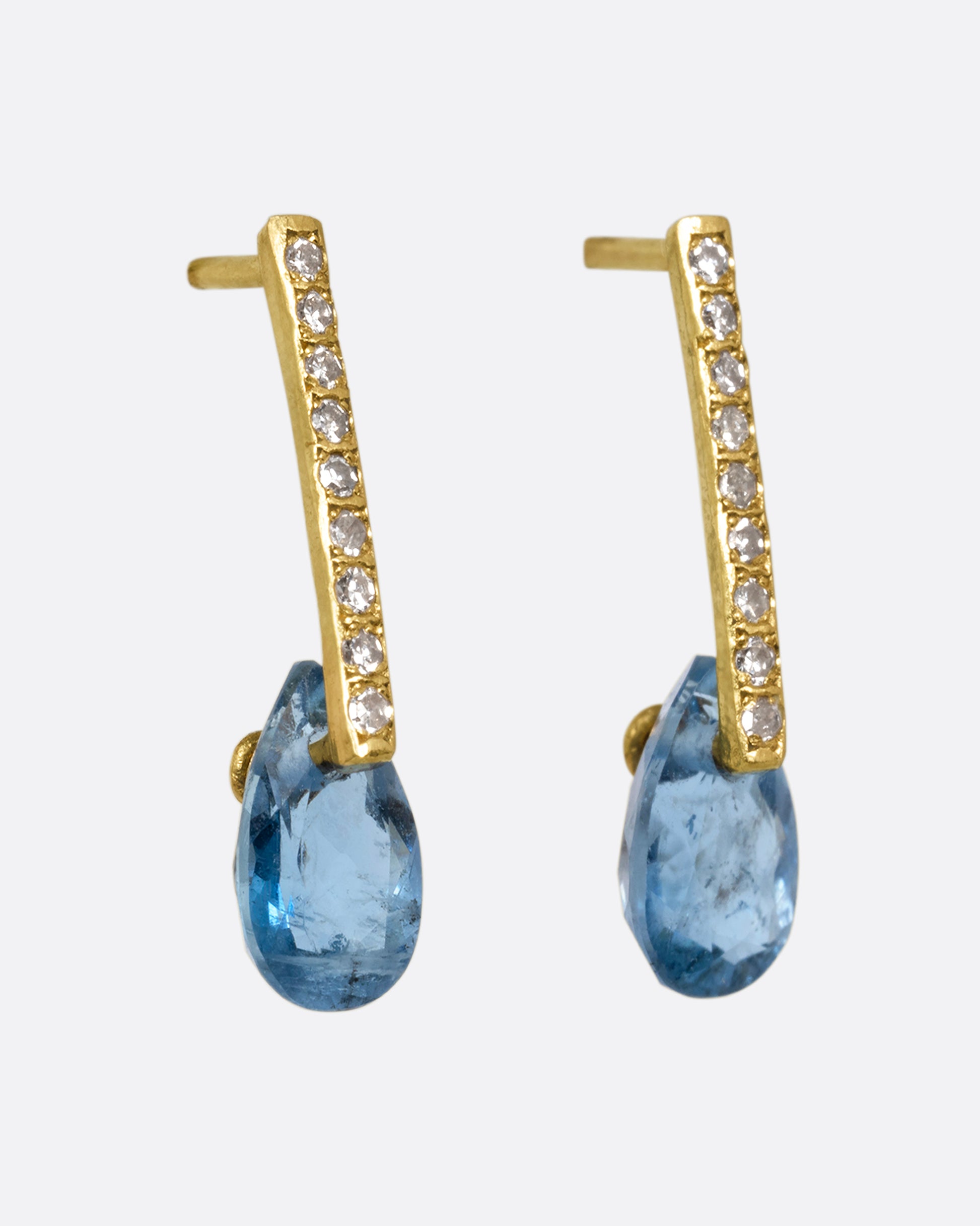 yellow gold earrings with aquamarines and diamonds  shown from the side 