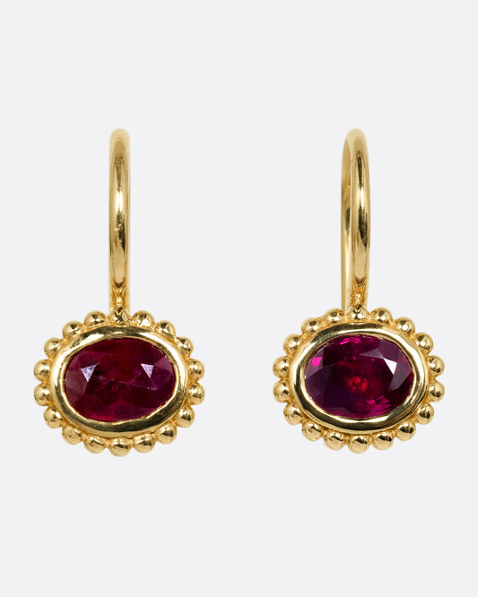 yellow gold ruby earrings shown from the front