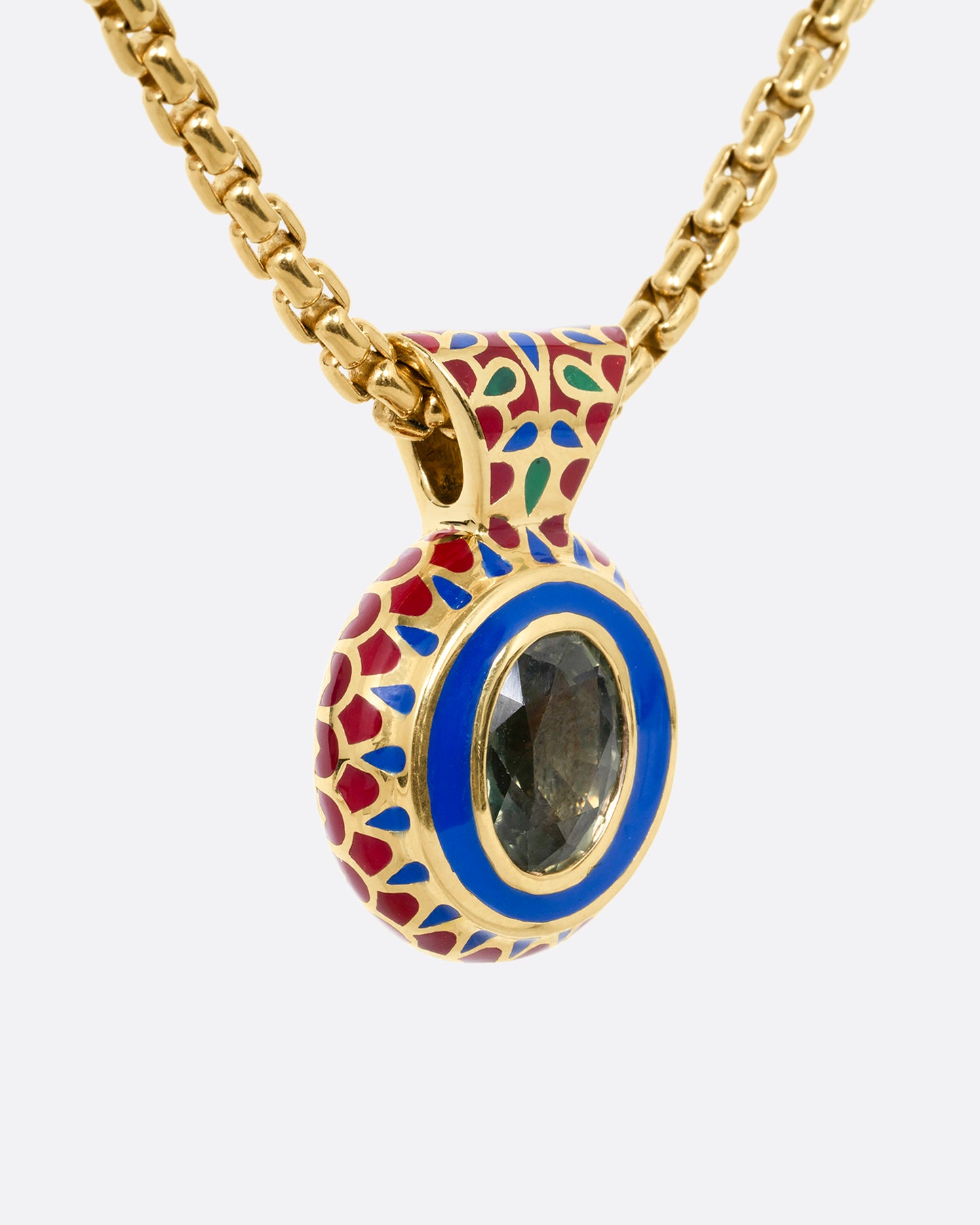 yellow gold green sapphire pendant with enamel shown from the side