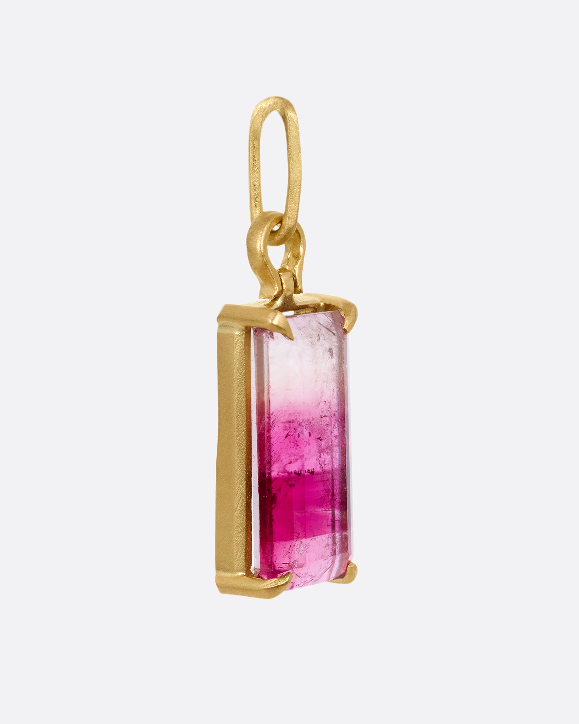 prong set pink tourmaline pendant shown from the side