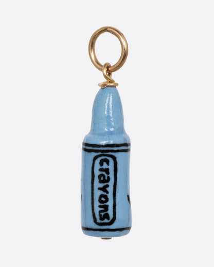 A blue crayon porcelain charm with a yellow gold bail. Shown from the back.