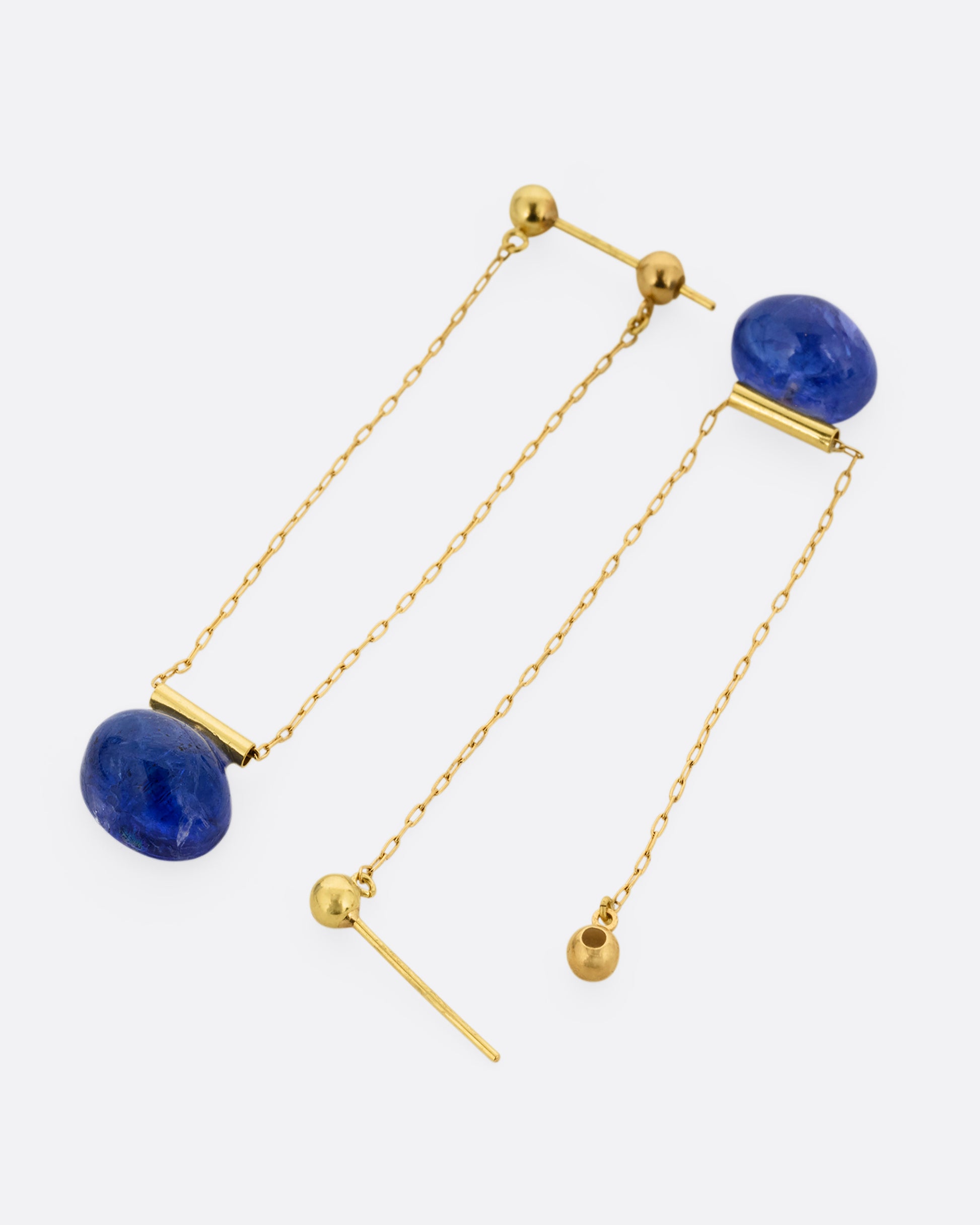 yellow gold chain earrings with tanzanite shown from the back
