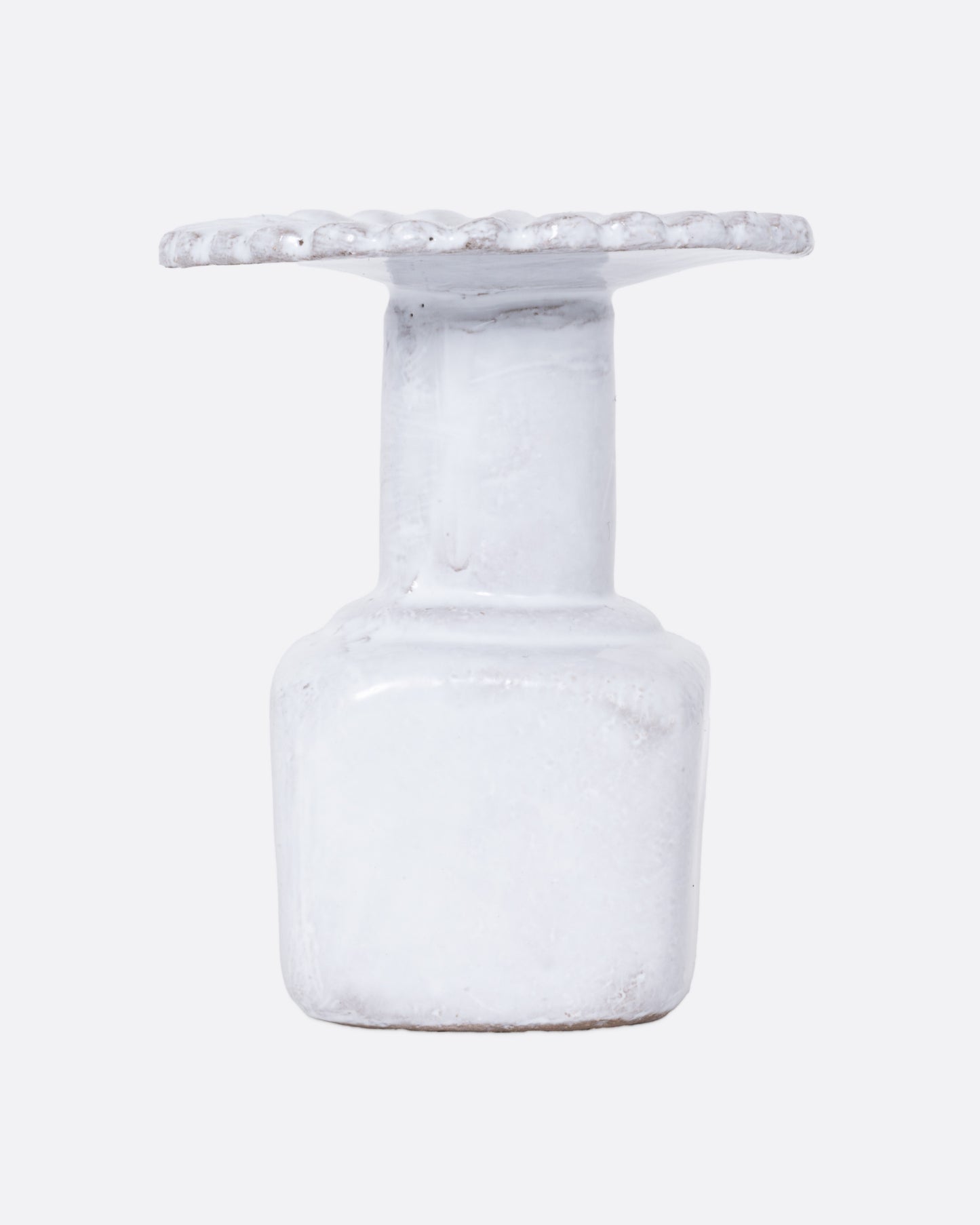  A white ceramic fluted incense holder, shown from the front.
