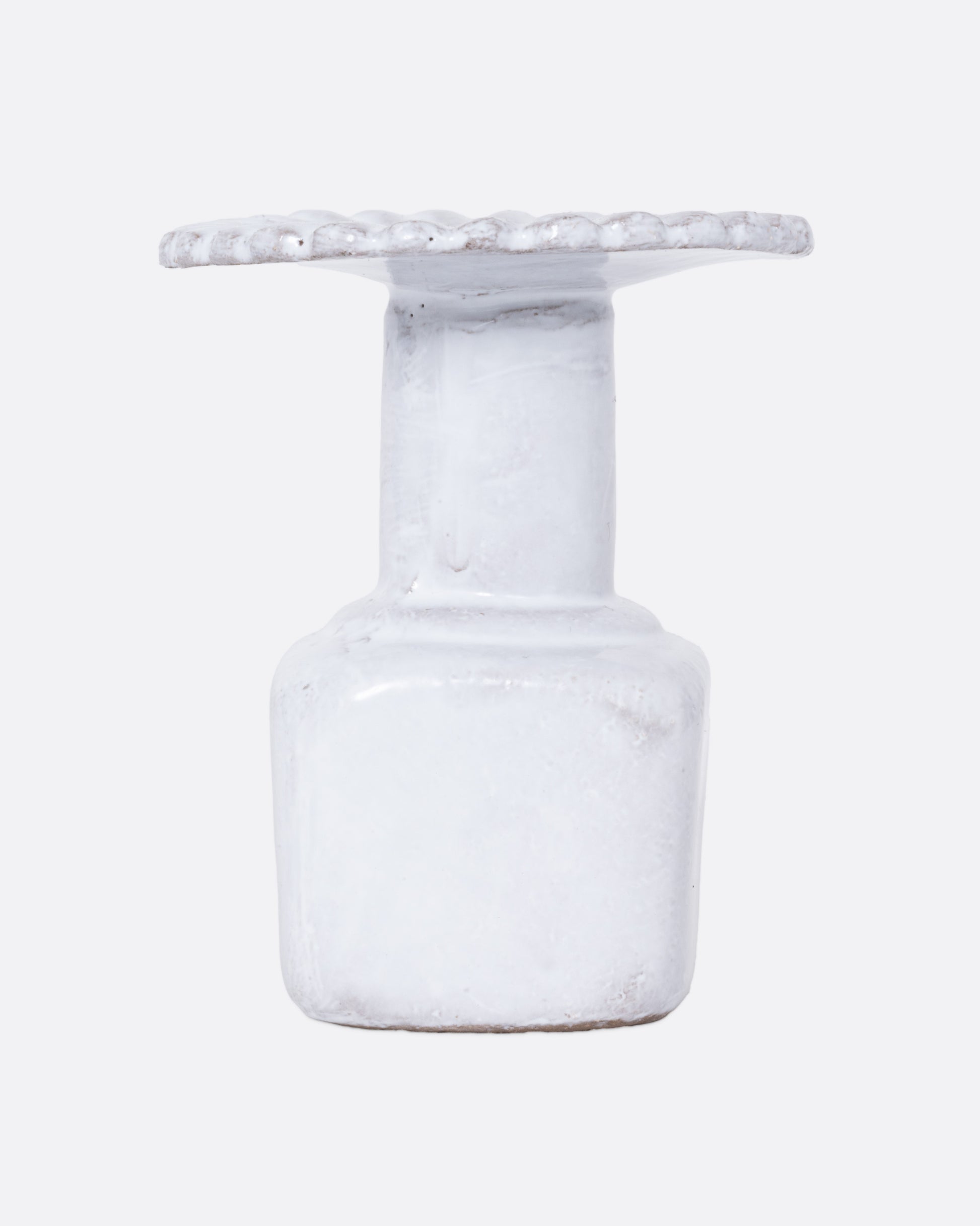  A white ceramic fluted incense holder, shown from the front.