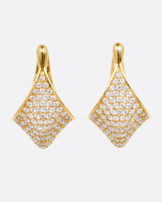 A pair of yellow gold angular hoop earrings covered in pave diamonds, shown from the front.