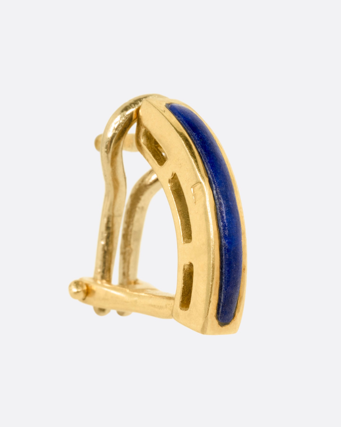 A yellow gold earring with an arched lapis bar, shown from the side.