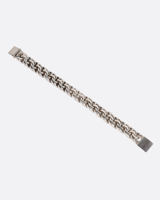 A silver flat double link bracelet, shown from the front.