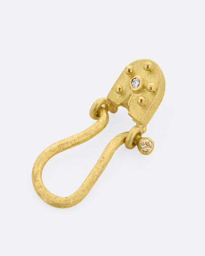 Yellow gold diamond charm holder pendant, angled view showing the diamonds and granulation
