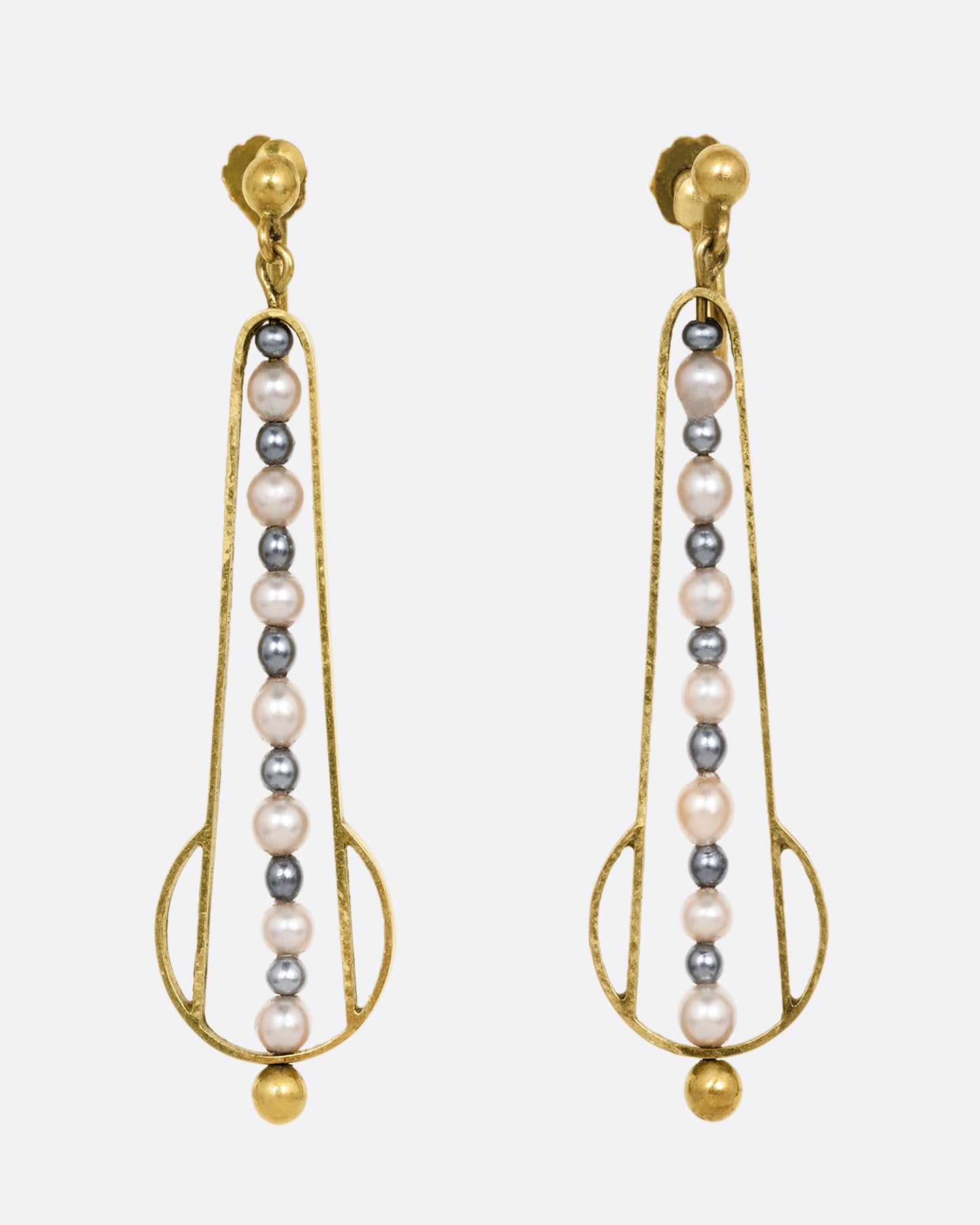 Yellow gold geometric dangle earrings with screw clasps and pearls down the center. Shown from the front.