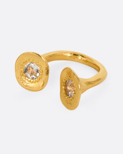Yellow gold aquamarine open ring, angled view of the two discs at the open ends of the band