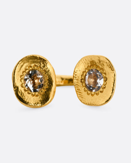 Oraik Reflections ring in 22k yellow gold, an open band with two hammered gold discs each set with an aquamarine