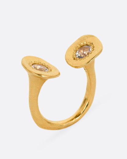 Yellow gold aquamarine open ring, tilted view showing the discs rising from the band