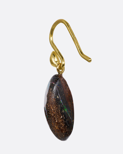 A single wing shaped opal with a yellow gold ear hook. Shown from the back.