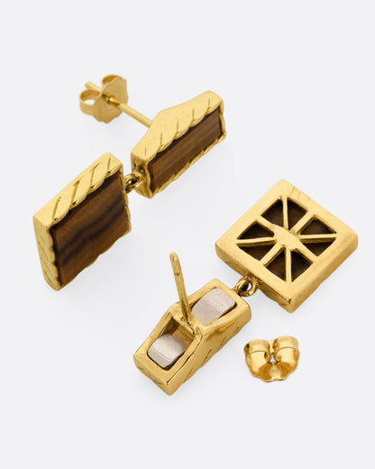 Vintage yellow gold tiger's eye drop earrings, the pair laid flat showing the posts and backs