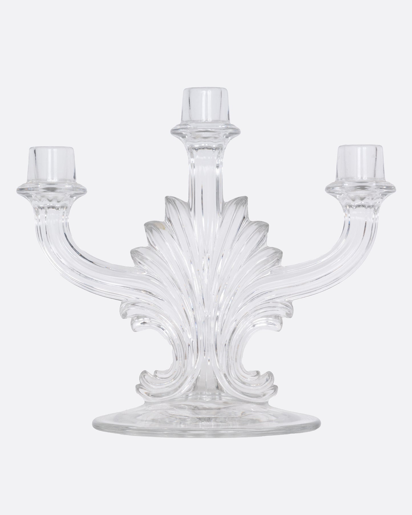 A clear glass candelabra with three holders, shown from the front.