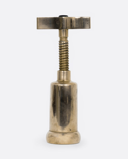 A brass twist wine bottle opener, shown from the front.