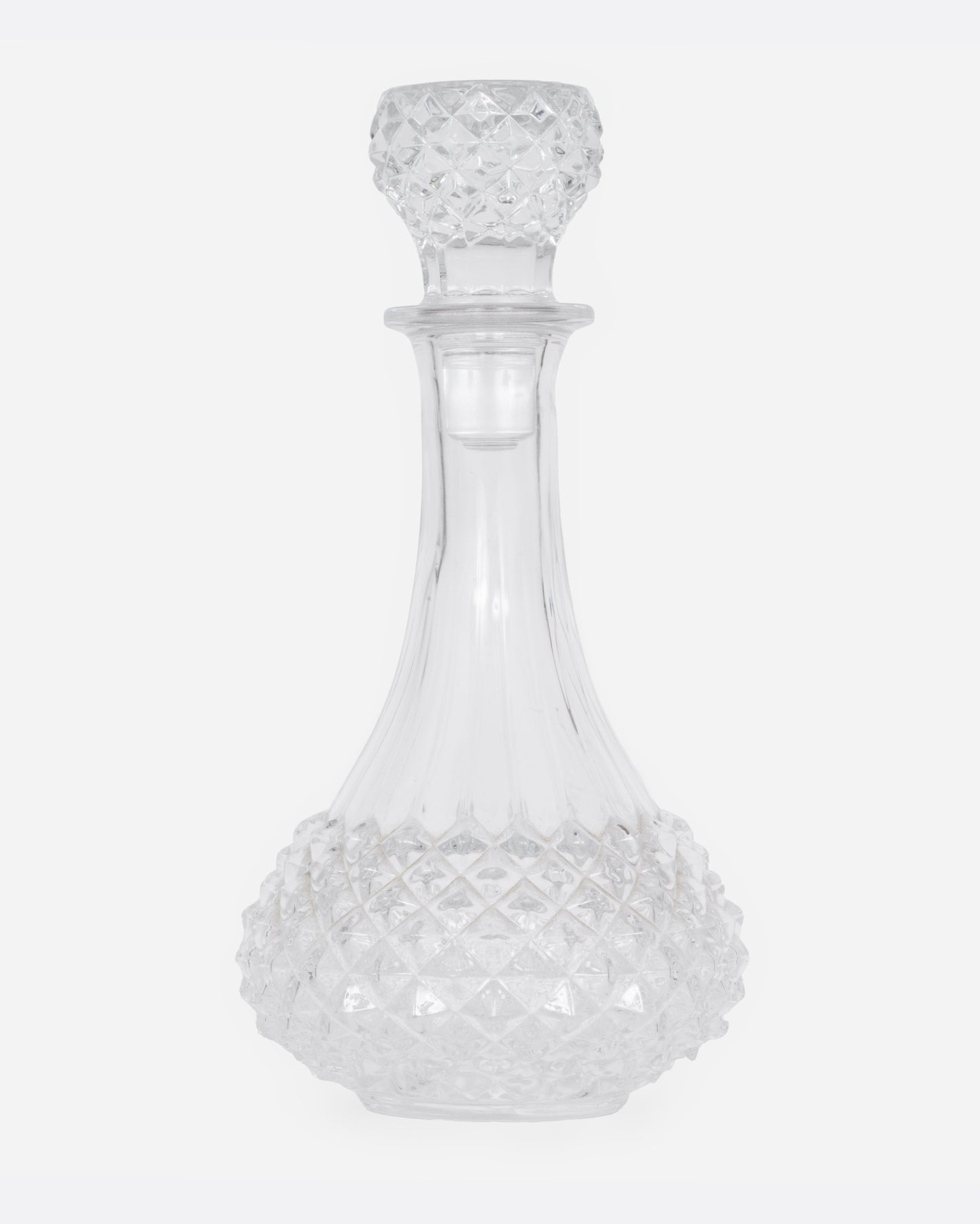 A crystal cut glass decanter, shown from the front.