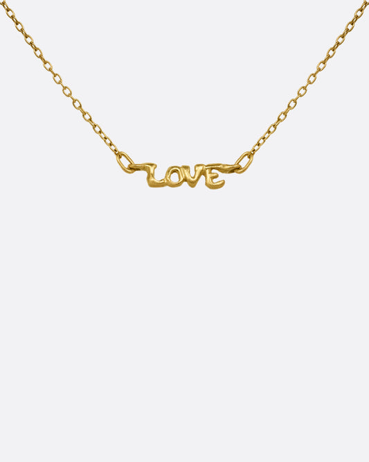 A yellow gold cable chain necklace with a 'LOVE' charm at the center. Shown from the front.