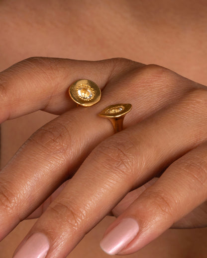 Yellow gold aquamarine open ring worn on a finger