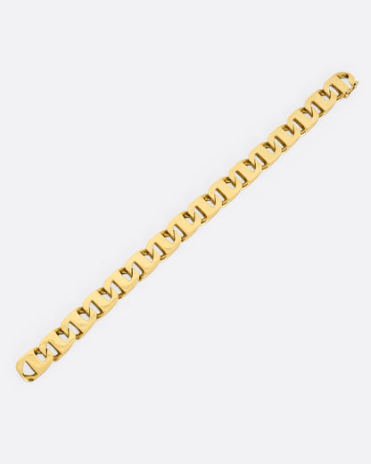 A yellow gold anchor link bracelet. Shown open lying flat from the top.