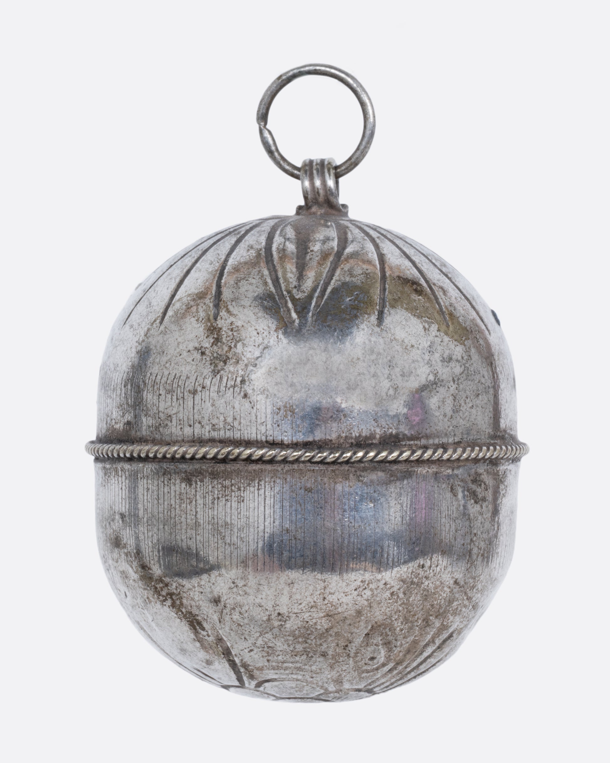  A silver engraved bell charm. Shown from the back.