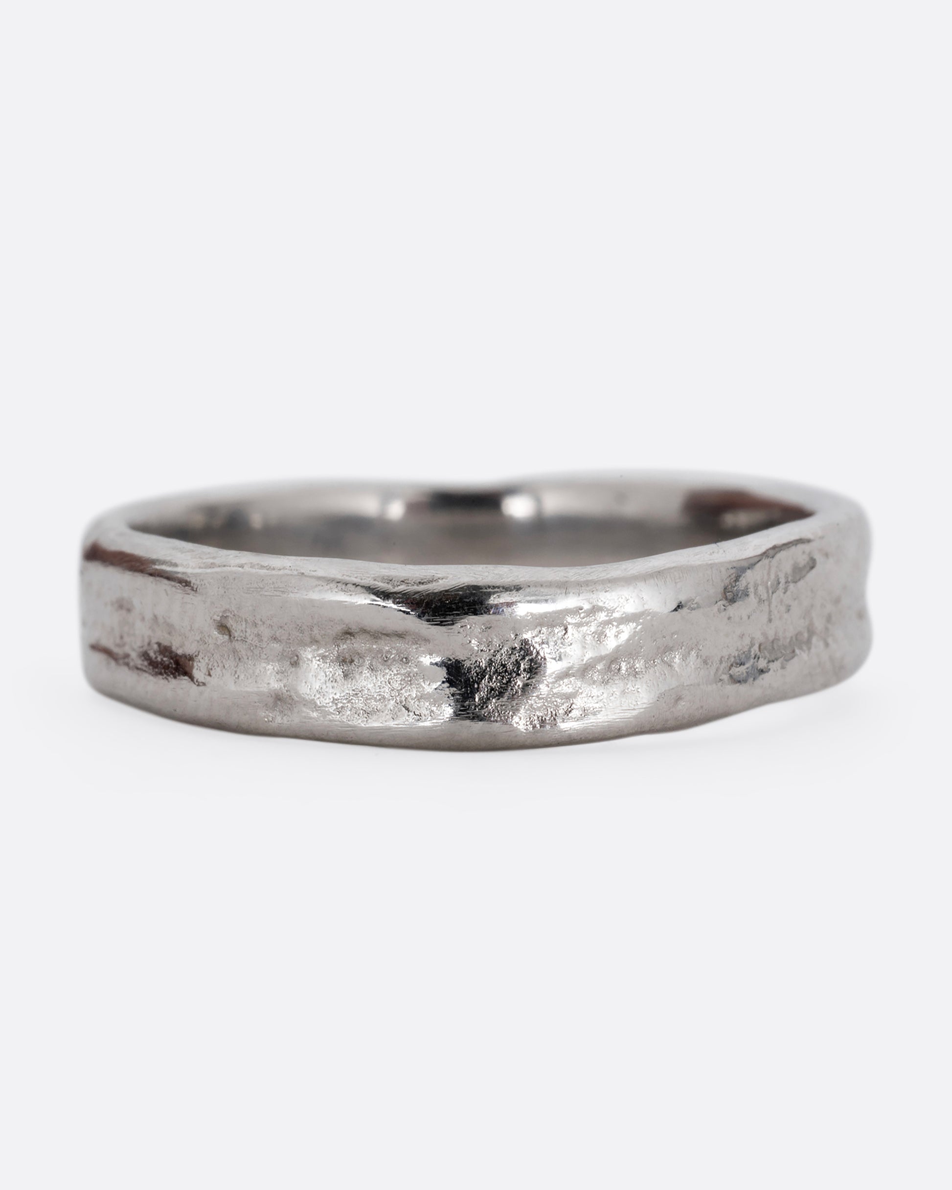 A platinum textured band with an irregular band, shown straight on.