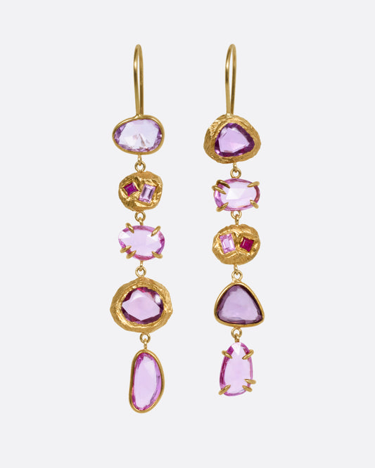 A pair of yellow gold drop earrings with pink sapphires and ruby and diamond accents, shown from the front.