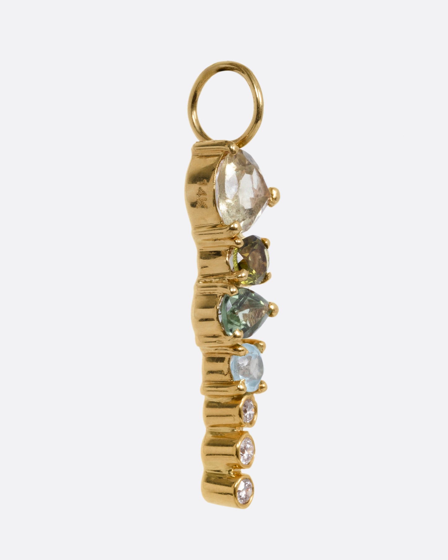 A yellow gold pendant with stacked tourmalines, apatites, sapphires, and diamonds, shown from the side.