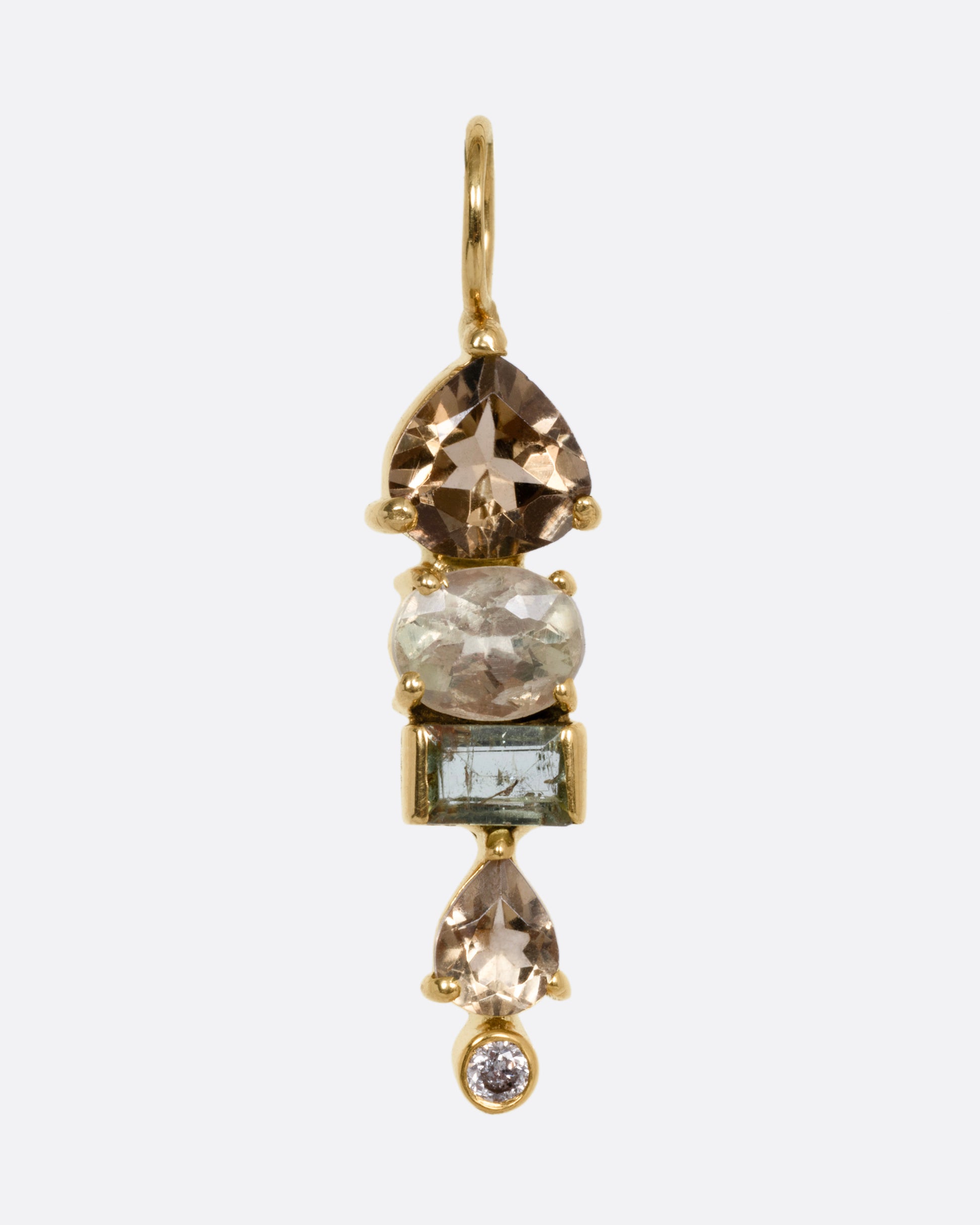 A yellow gold pendant with stacked tourmalines, sapphires, and diamonds, shown from the front.