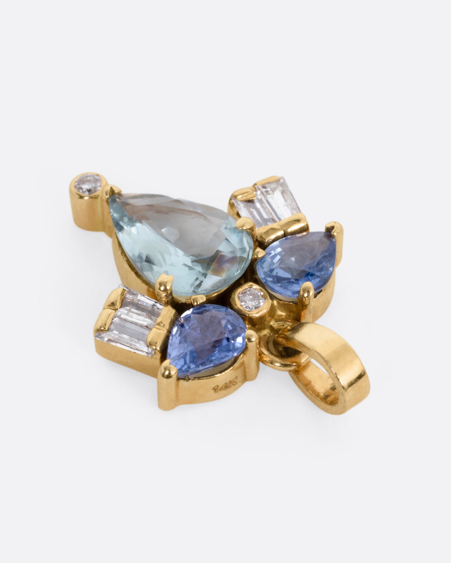A yellow gold sapphire and diamond pendant in the shape of a firefly, shown lying flat from the top.