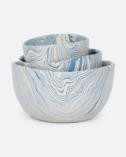 Blue and cream marbled ceramic bowl, the three sizes nested together