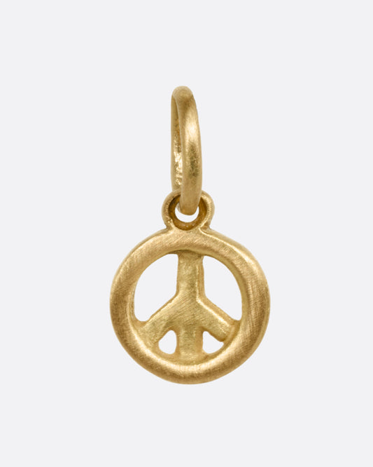 A yellow gold peace sign pendant shown from the front.