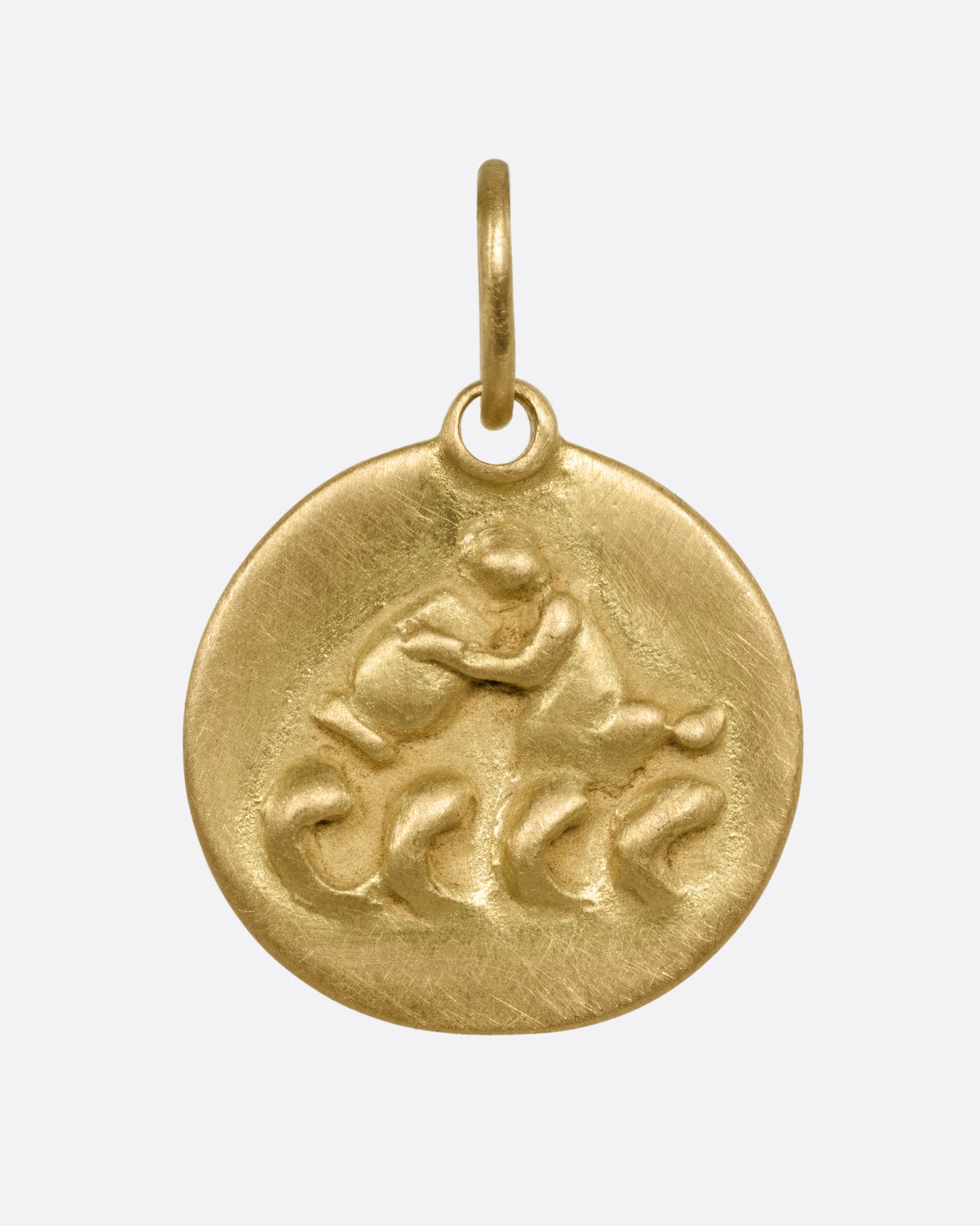 A circular yellow gold Aquarius pendant with the water bearer, shown from the front.